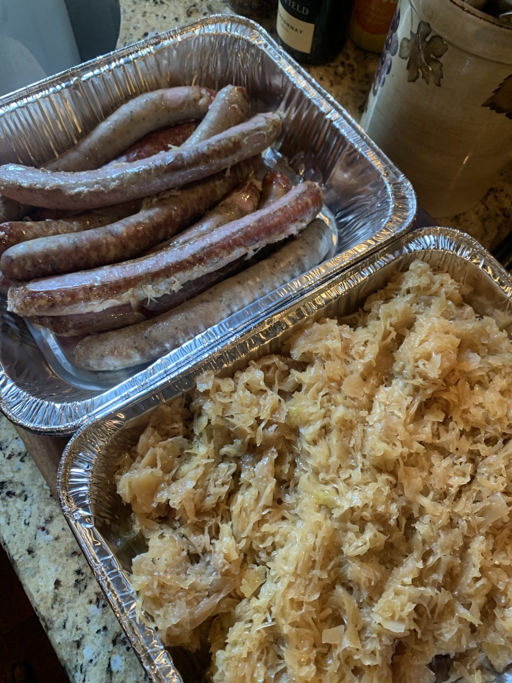 A tin of sausages next to a tin of kraut