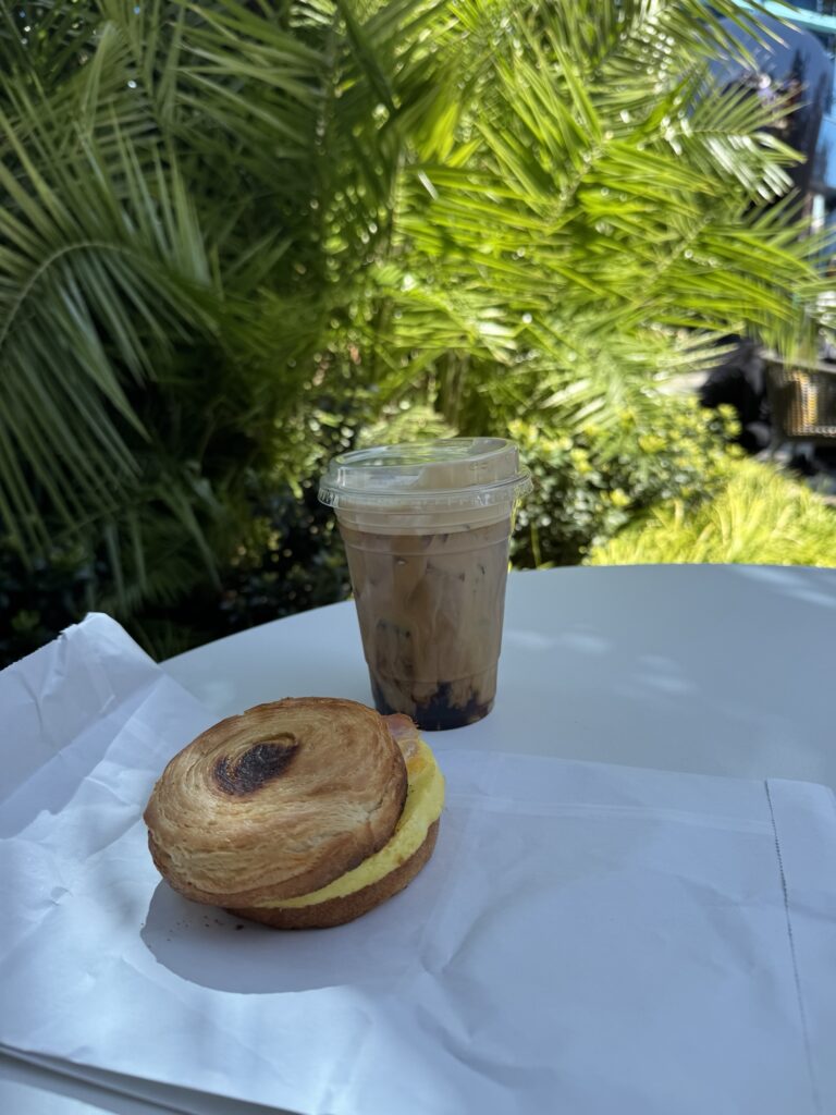 Iced coffee and an egg and bacon pastry