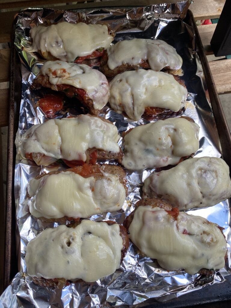 Cheese melted on top of the sausages