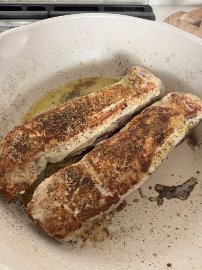 Cooked pork tenderloins in a pan