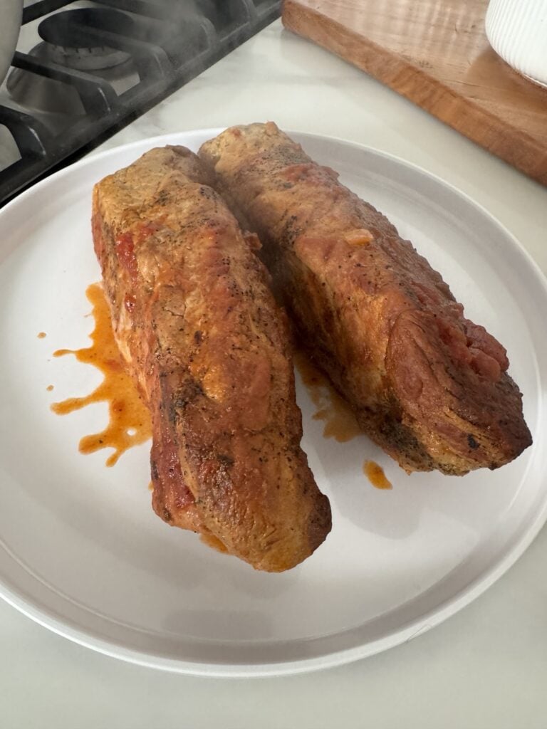 Cooked pork tenderloins on a plate