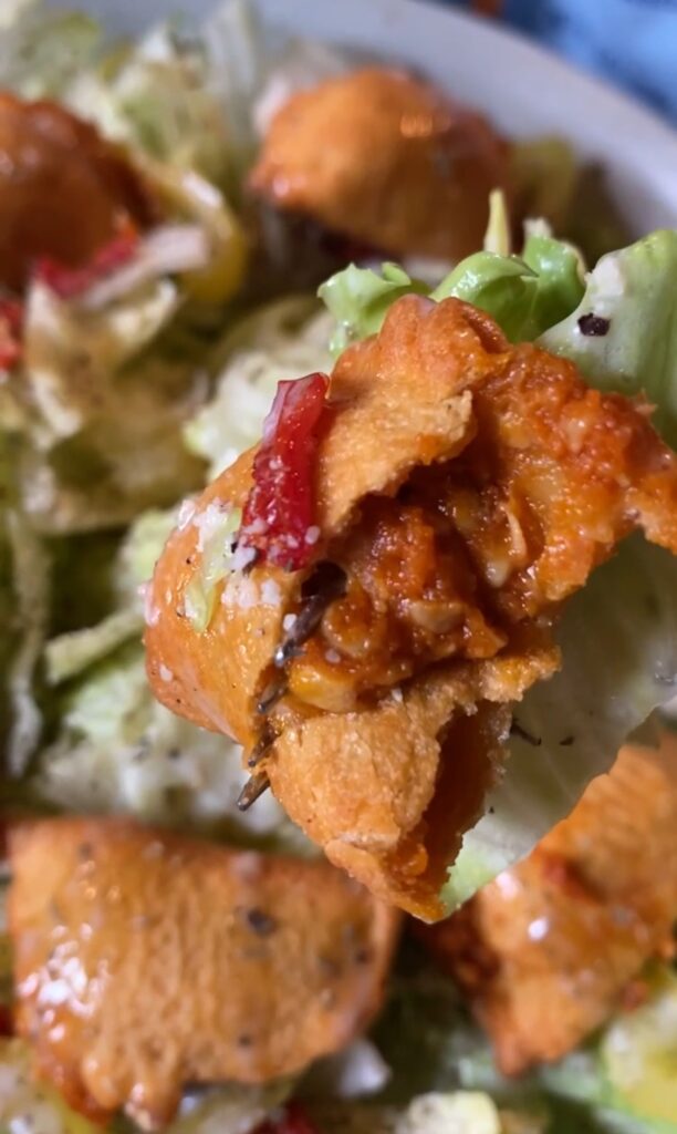 A close up of a halved pizza roll