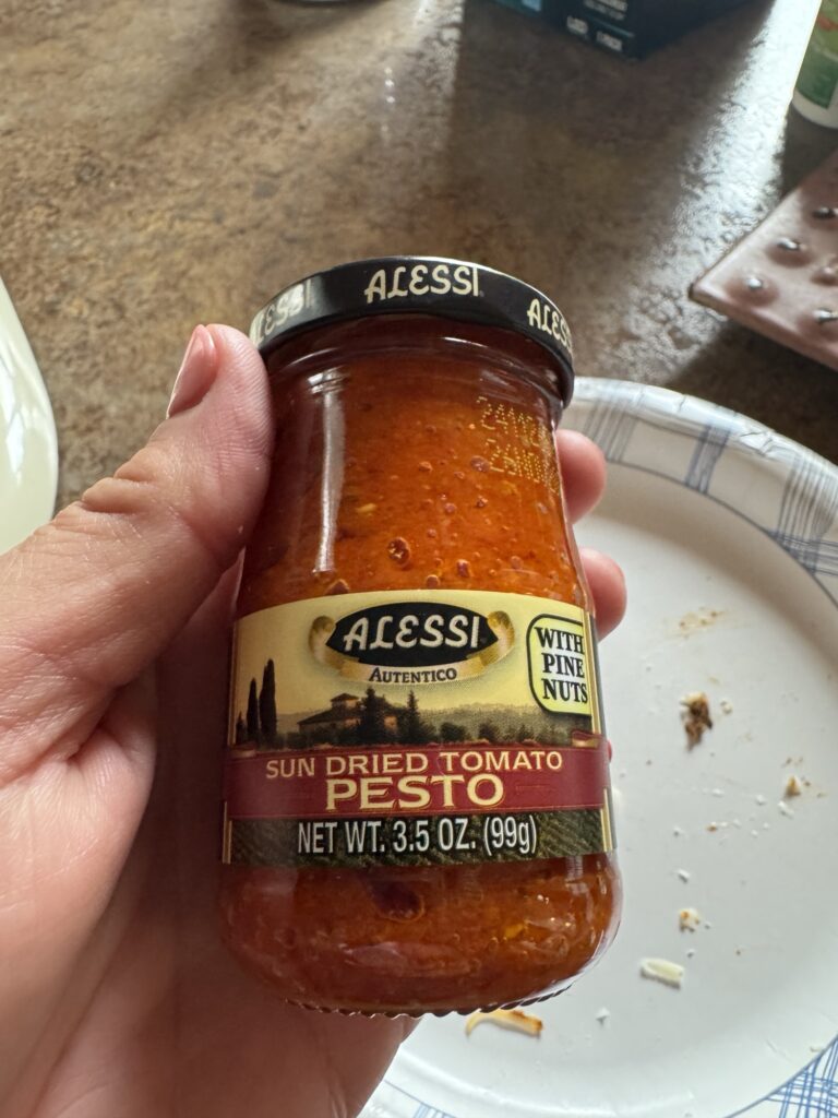 A jar of sun dried tomato pesto