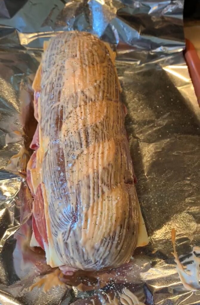 The sandwich with the spread applied to the outside before baking