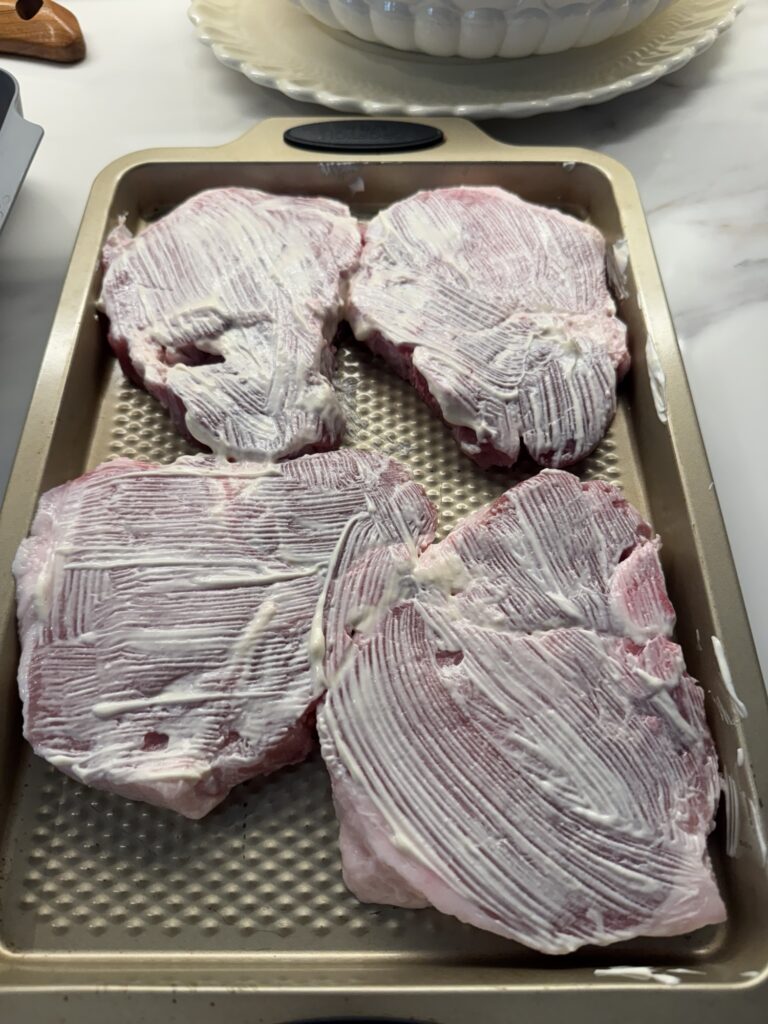 Pork chops covered in mayo