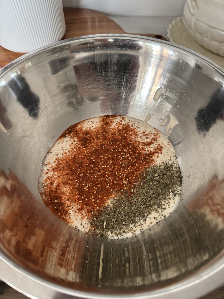 Dressing mixture in a metal bowl