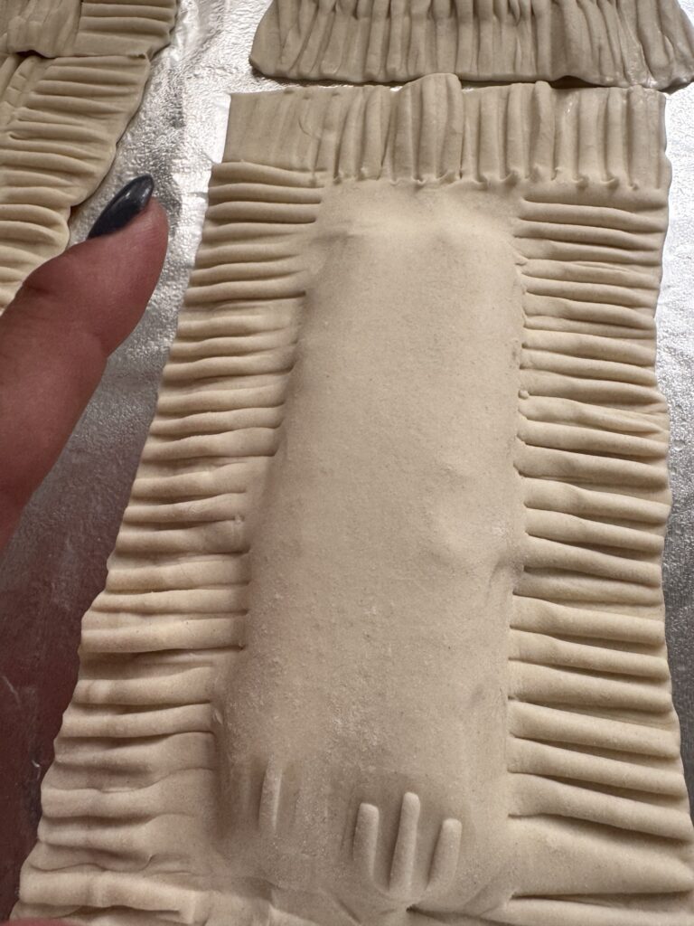 Puff pastry covering the hot dogs