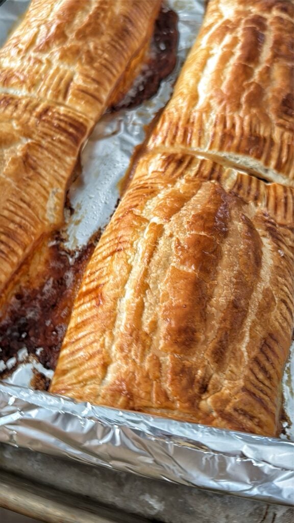 The finished baked pastry dogs