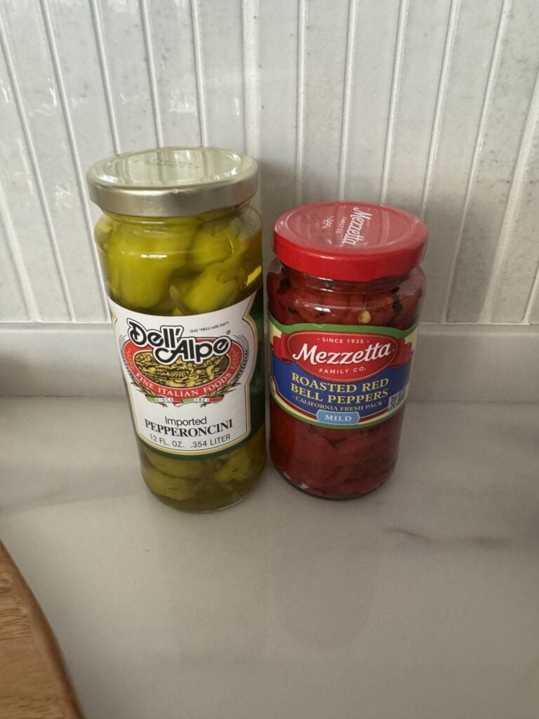 Jars of pepperoncini and roasted bell peppers
