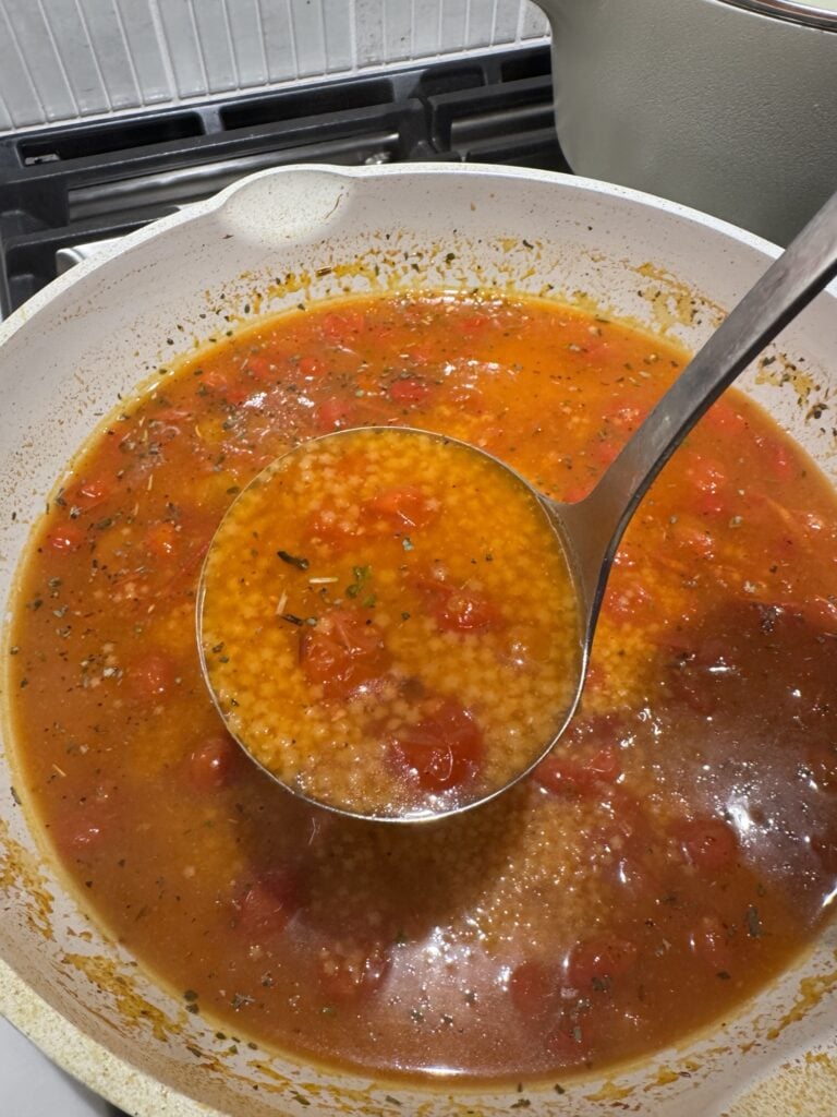 A ladle of the Tomato Pastina soup